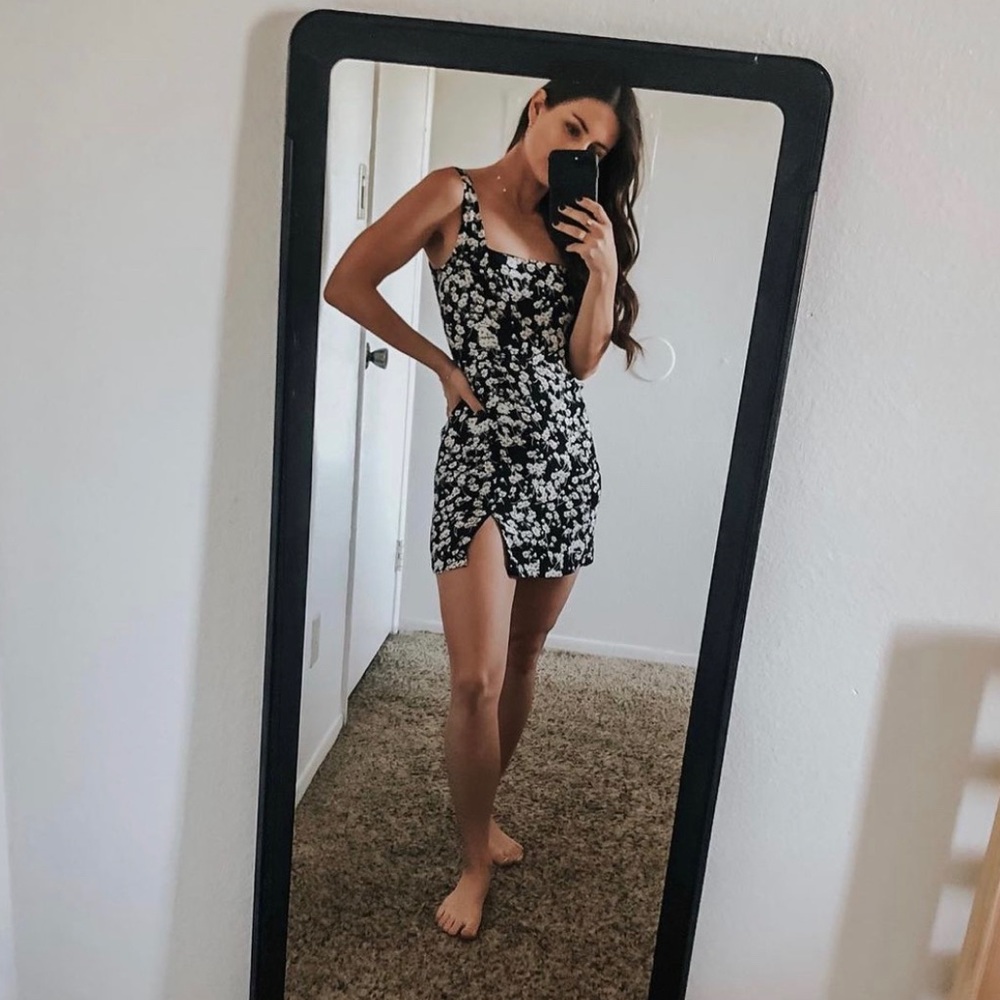 Daisy print black mini dress